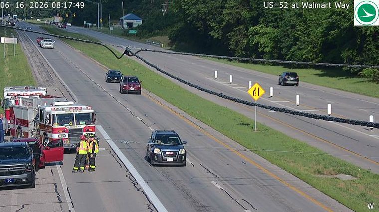 Fire rescue vehicles and personnel on the roadside attending to an incident.