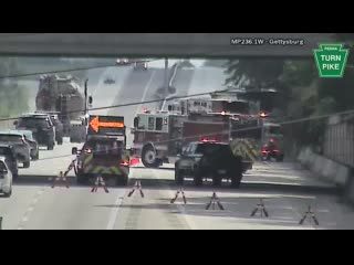Fire truck and other emergency vehicles with cones and barriers in the roadway