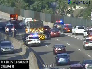 Police car with red and blue lights on the roadway