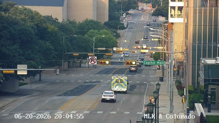 Ambulance with lights on in the middle of the road