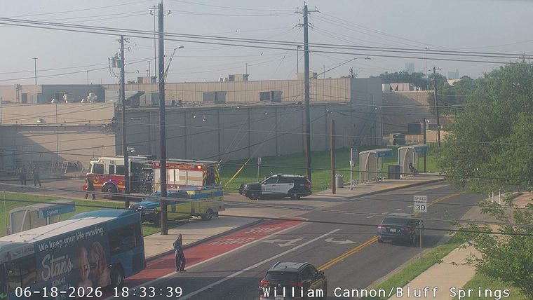 Fire truck and police car on the side of the road