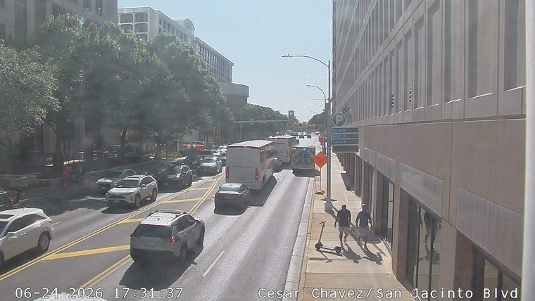 Ambulance with flashing lights in the right lane