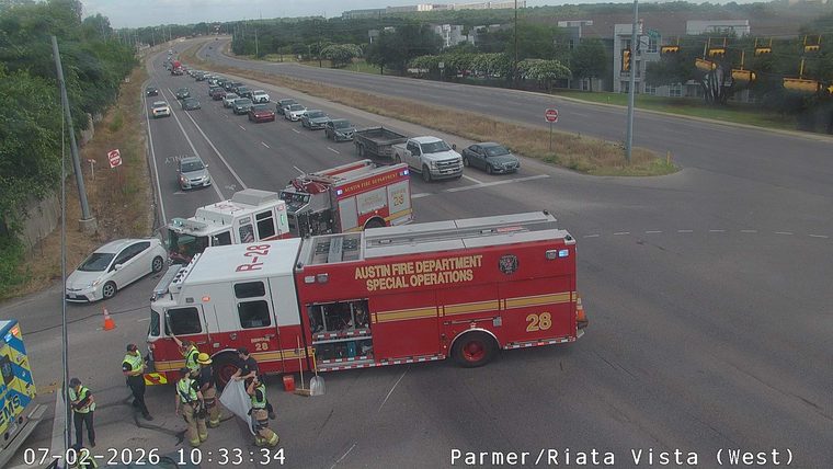 Austin Fire Department vehicles and personnel on the roadway