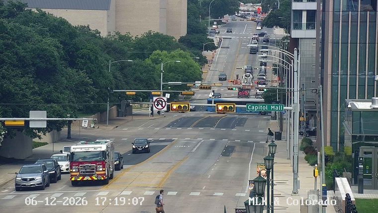 Fire truck on scene at intersection with traffic.