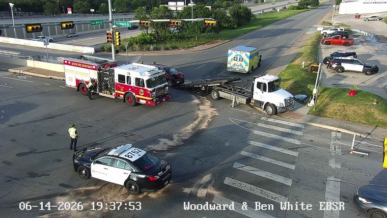 Fire truck, police, and EMS responding to an incident at Woodward & Ben White.