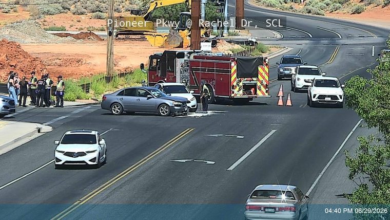 Fire truck and multiple individuals in uniform at the intersection