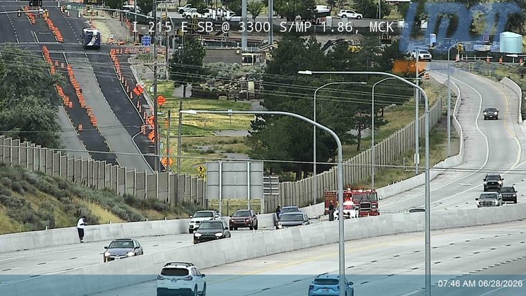 Fire truck with red and blue lights on the right shoulder