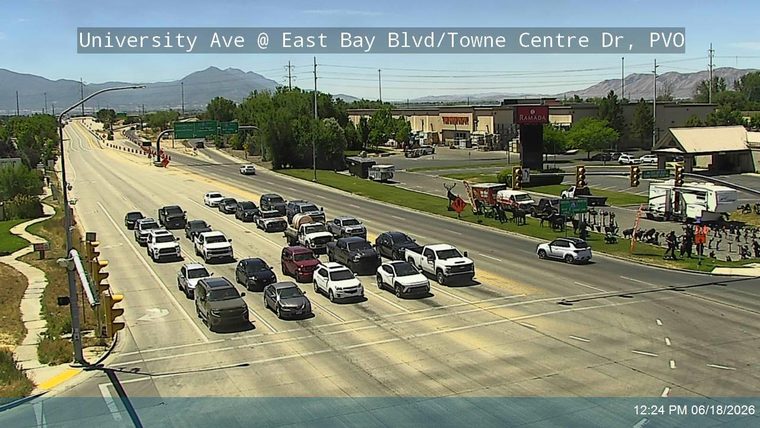 Emergency responders and equipment are present on the roadway.