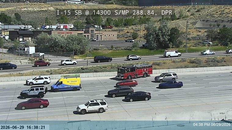 Fire truck with 'DRAPER CITY FIRE DEPT' markings in the right lane