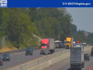 Emergency vehicle with lights on in the right lane