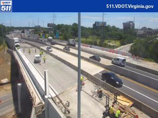 Multiple responders and vehicles on highway, possibly construction or incident.
