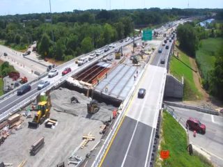 Construction zone with emergency responders and vehicles on the roadway.