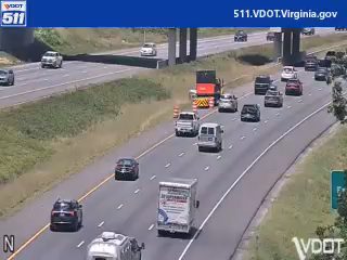 Traffic incident with a truck and cones on the highway.