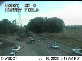 Emergency responders and vehicles are present near a construction zone on SR 9.