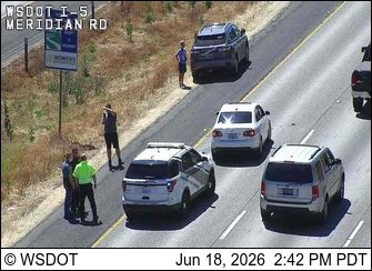 Police car with lights on the shoulder
