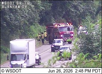 Fire truck and several people on the right shoulder