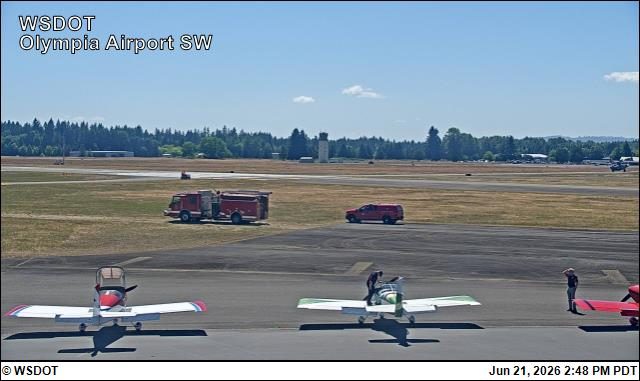 Fire truck and red SUV on the airfield