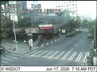 Emergency responders on scene with cones and closed sign on ramp.