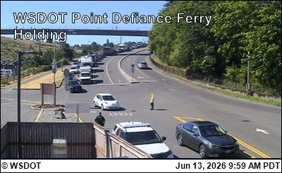 Traffic control personnel directing vehicles on the roadway.