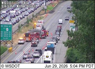 Fire truck and other emergency vehicles on the right shoulder