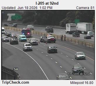 Tow truck and two workers on the right shoulder