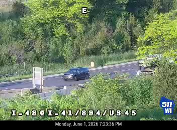 Emergency responders and vehicles on the roadside, possibly assisting with an incident.