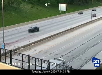 Blood stain on roadway indicates a possible crash or injury.
