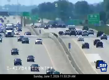 Multiple vehicles involved in a crash on the highway, causing traffic backup.
