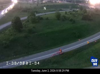 Emergency responder with cones on the shoulder of I-39/90 @ I-94.