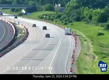 Construction cones and barrels in the right lane and shoulder