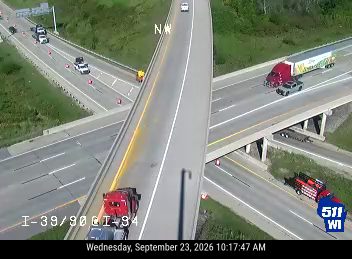 Police car and construction cones in the left lane