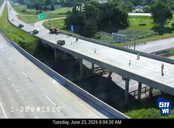 Construction cones and workers on the overpass