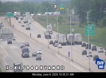 Multiple vehicles stopped on highway, likely due to a crash ahead.