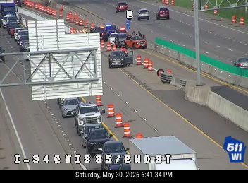 Emergency responders and vehicles are present on the highway, indicating an incident.
