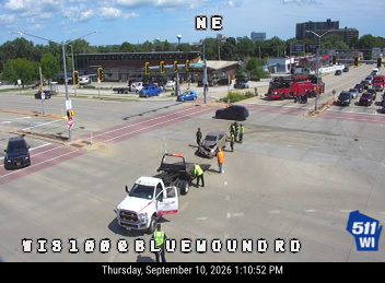 Two vehicles collided in the intersection with a tow truck and emergency personnel present