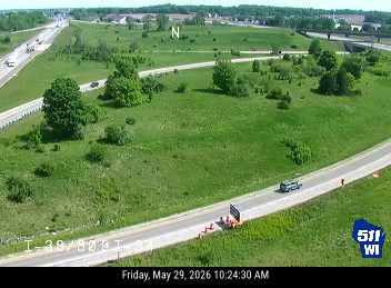 Emergency vehicle and cones on the shoulder of I-39/90/94 EB.