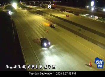 Construction cones and a trailer with equipment in the right lane