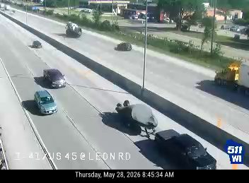 Vehicle overturned on highway, blocking traffic.