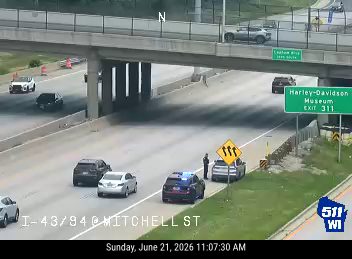 Police car with lights on the right shoulder