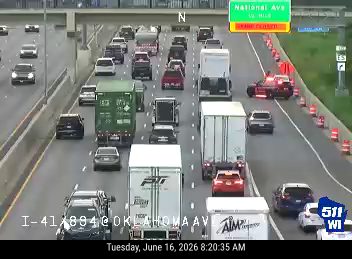 Police car with lights on the right shoulder