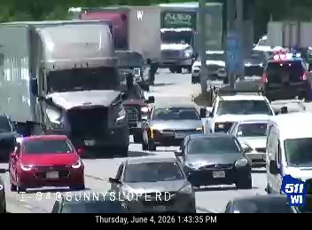 Emergency vehicles and traffic congestion on the highway.