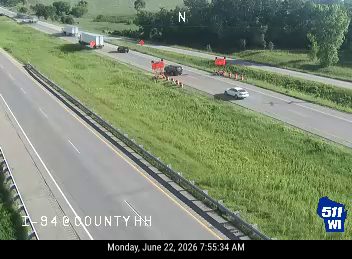 Construction cones and workers in the right lane