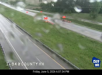 Emergency responders and equipment are present on the highway, likely for an incident.