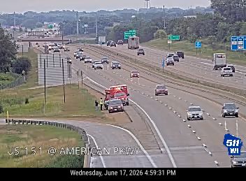Ambulance and two people on the right shoulder