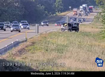 Vehicle overturned on the right shoulder of the highway.