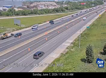 Construction equipment and cones indicate a possible work zone or incident response.