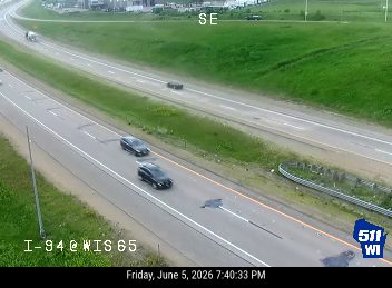 Large debris object on the roadway, possibly a mattress or large tarp.