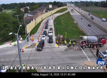 Construction cones and workers in the right lane