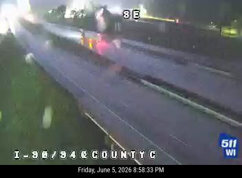 Emergency responders on I-90/84 at County C with flashing lights.