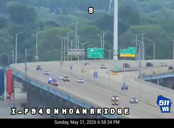 Police car and emergency vehicle on the highway, possibly responding to an incident.